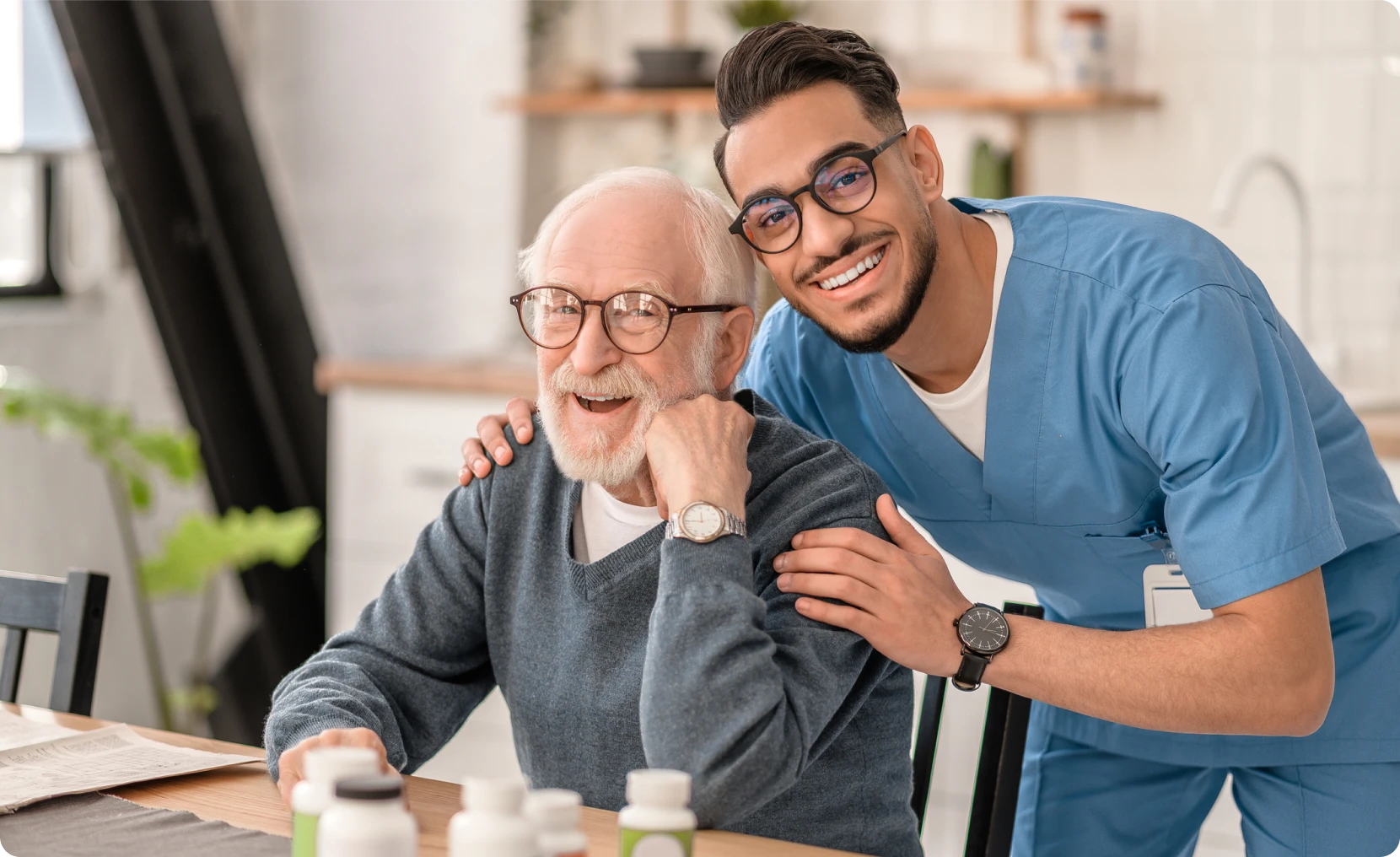 Nurse supporting elderly man