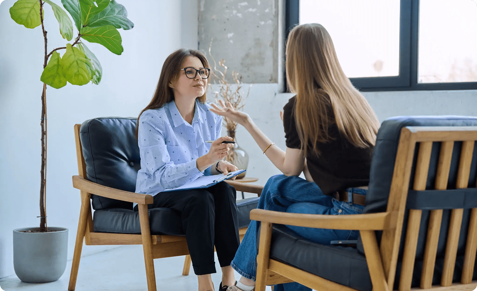 Two women having a conversation indoors